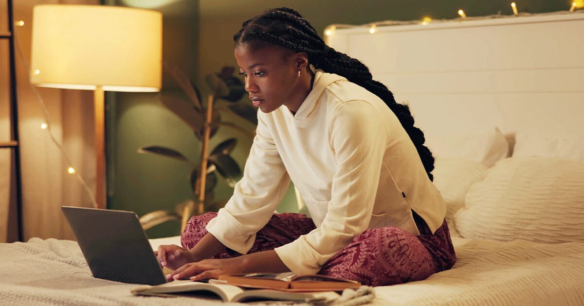 Woman researching her pregnancy options privately on her laptop after an unexpected pregnancy.